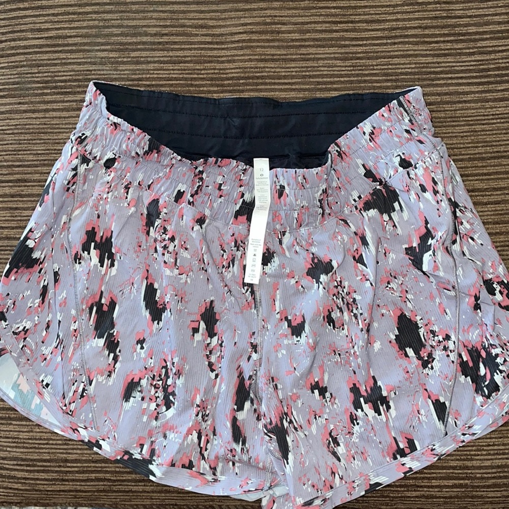 Lulu lemon womens track that 5” short.  New w/o tags.  Grey/black/burgundy color